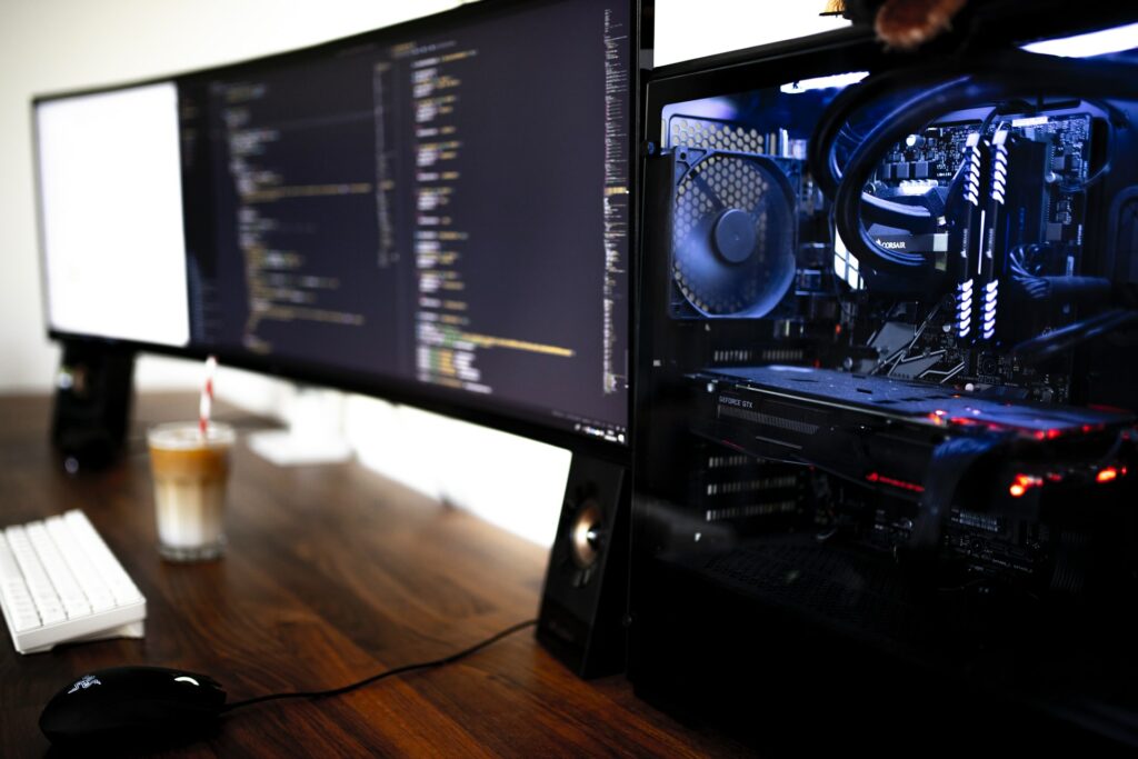 A powerful gaming PC with two wife monitors on a desk ready to do some 4K Stream Capture