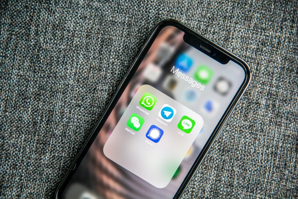 An iPhone with various messaging apps including Telegram which you could stream to from telegram desktop streaming solutions like XSplit Broadcaster.