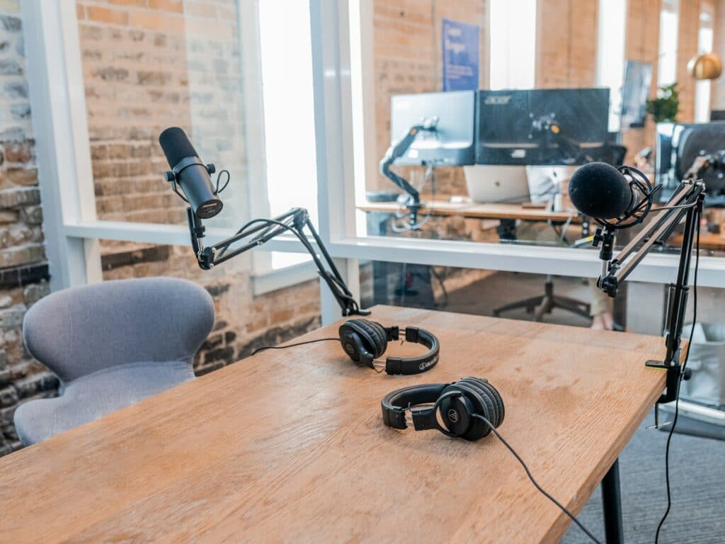 A podcast studio with a PC setup in the background to livestream a podcast.