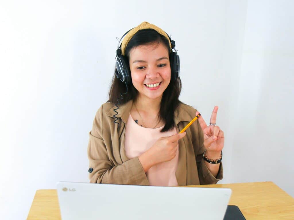 A teenage girl taking part in an online class.