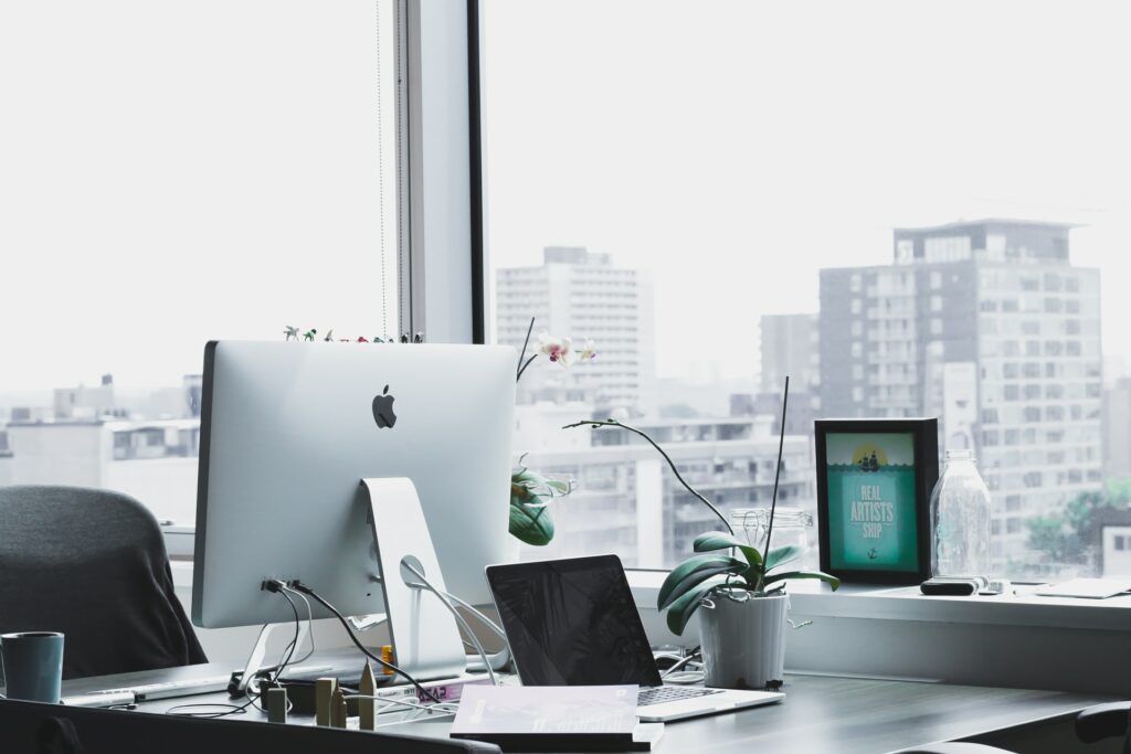 An office scene with a computer on a desk as a free webcam background