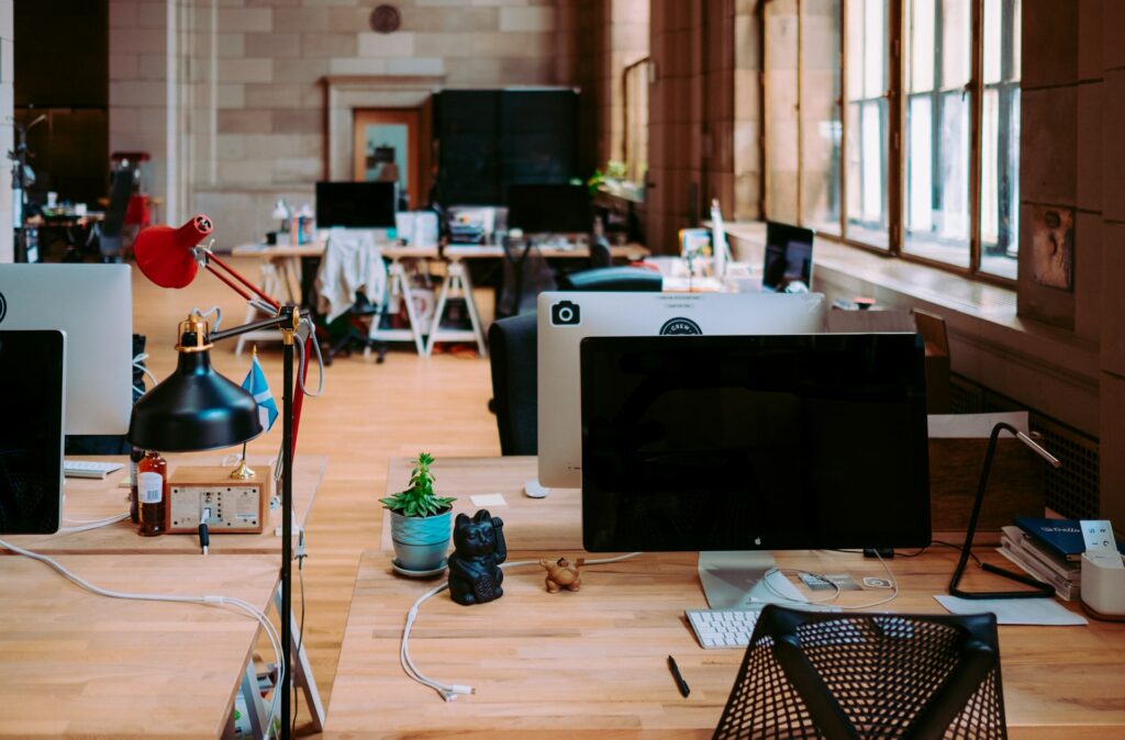 An open plan office with computers on desks as a free webcam background