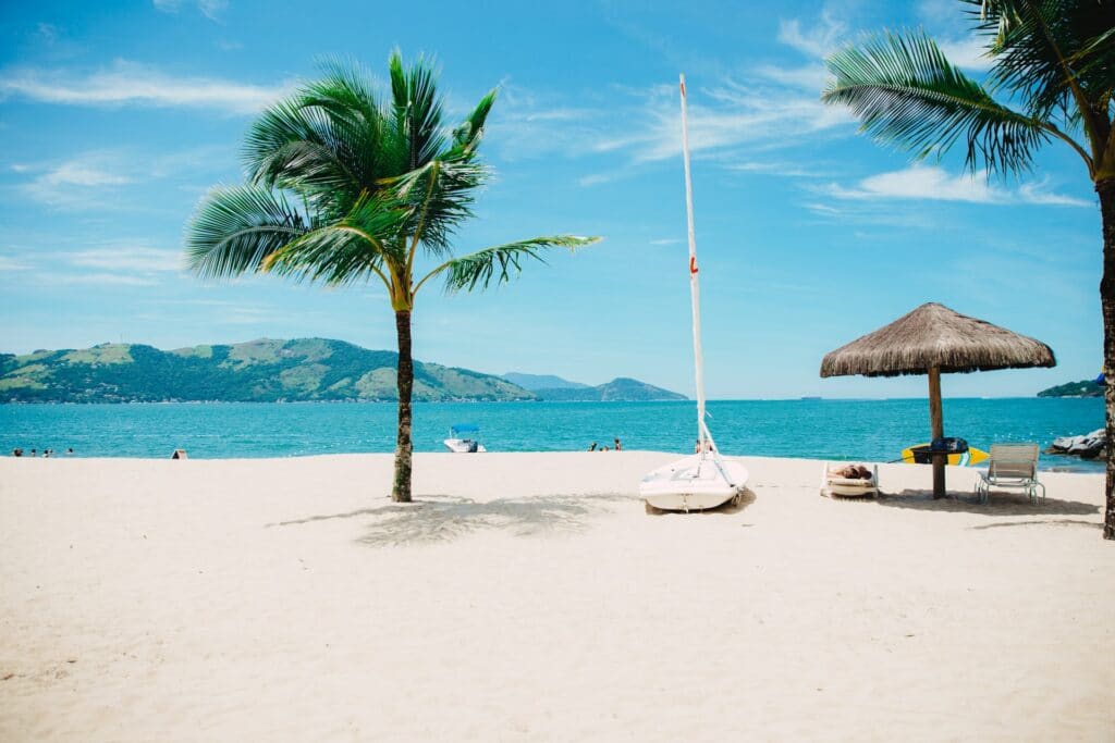 A clean beach with a large umberella