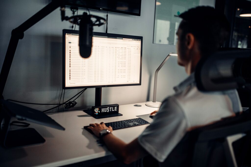 A remote worker at their work station using remote team management software.