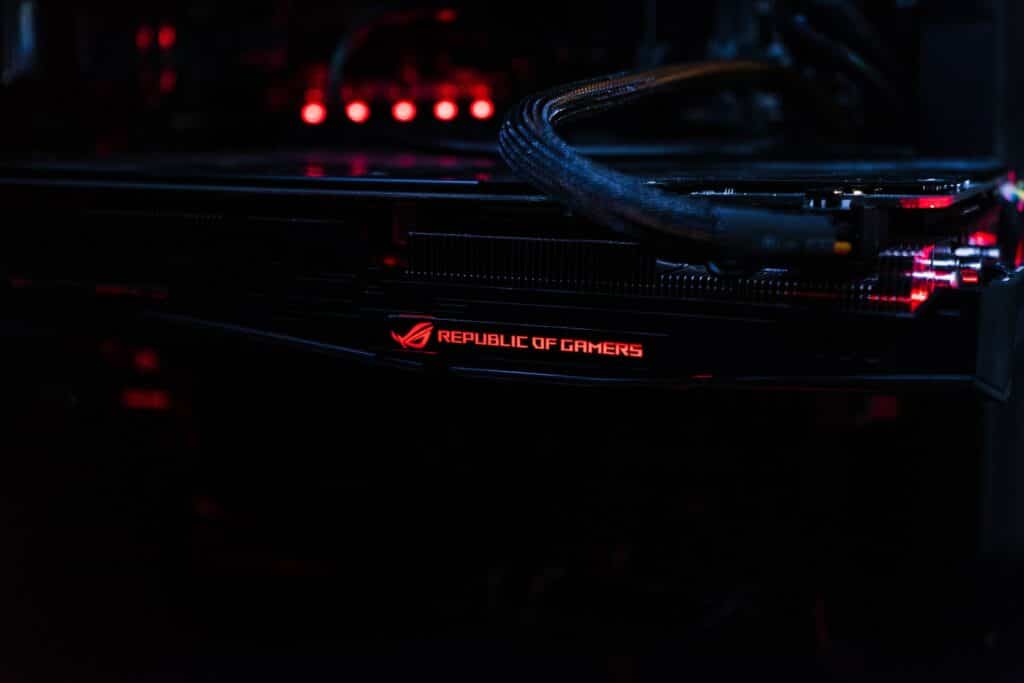 A graphics card inside a PC with its RGB lights on.